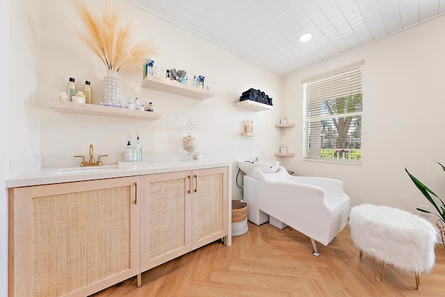 interior space with a sink and indoor wet bar