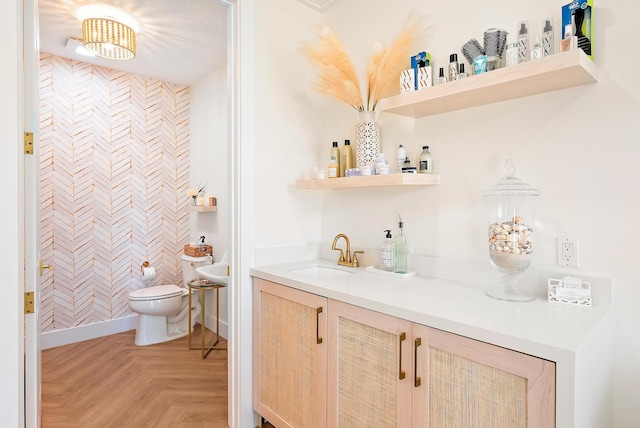 bar with wet bar, a sink, and baseboards