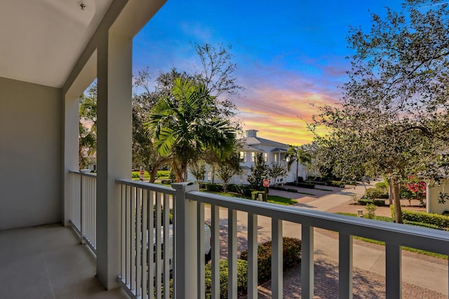 view of balcony at dusk