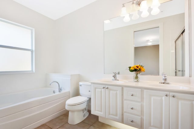 bathroom featuring a bath, tile patterned flooring, a sink, and toilet