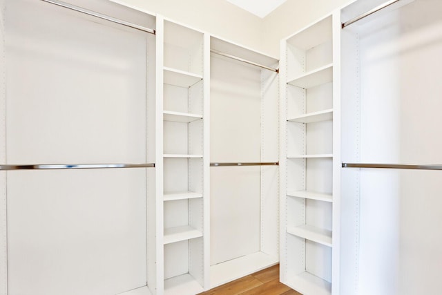 walk in closet featuring light wood finished floors