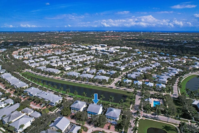 drone / aerial view featuring a water view and a residential view