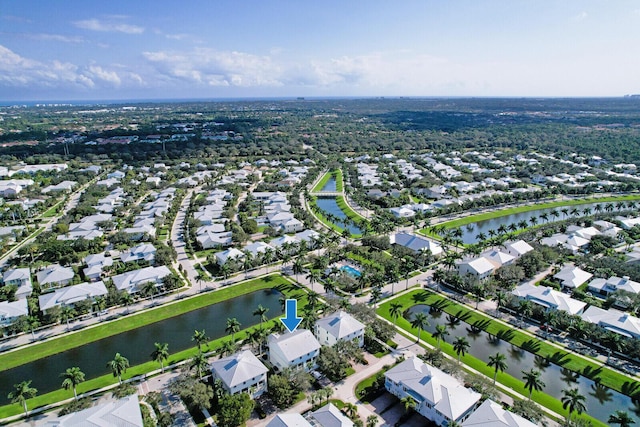 birds eye view of property featuring a residential view and a water view