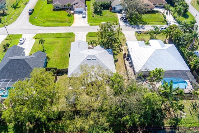 birds eye view of property with a residential view