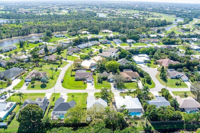 bird's eye view featuring a water view and a residential view