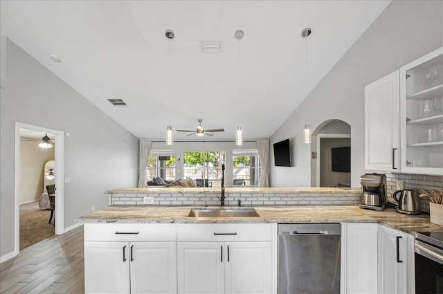 kitchen featuring a sink, white cabinetry, glass insert cabinets, and stainless steel dishwasher