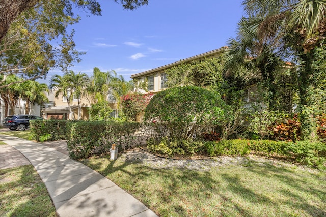 9832 Stover Way, Wellington, FL 33414 - exterior space featuring stucco siding and a front lawn