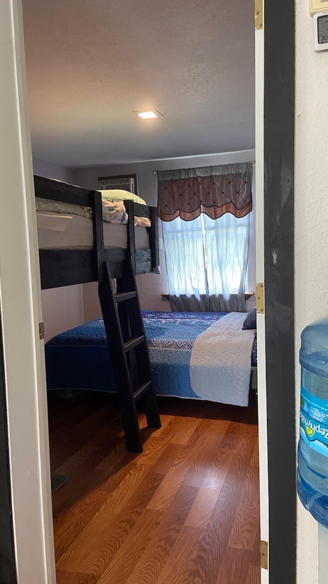 bedroom featuring wood finished floors