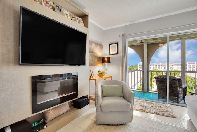 living area with ornamental molding, a glass covered fireplace, and tile patterned floors