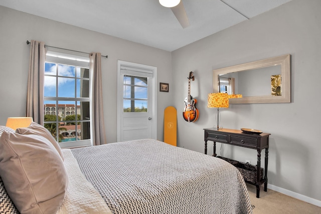 bedroom featuring carpet, baseboards, and ceiling fan