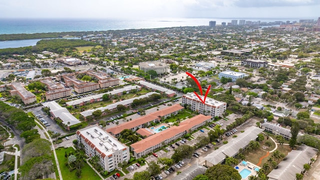 birds eye view of property with a water view