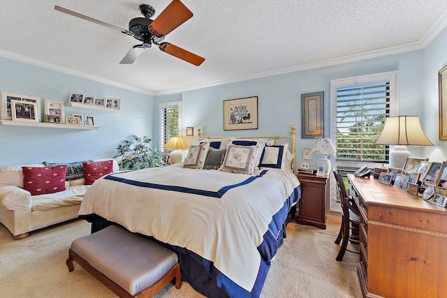 bedroom featuring ornamental molding, light carpet, ceiling fan, and a textured ceiling