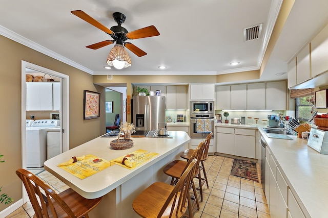 kitchen with visible vents, light countertops, appliances with stainless steel finishes, and white cabinetry