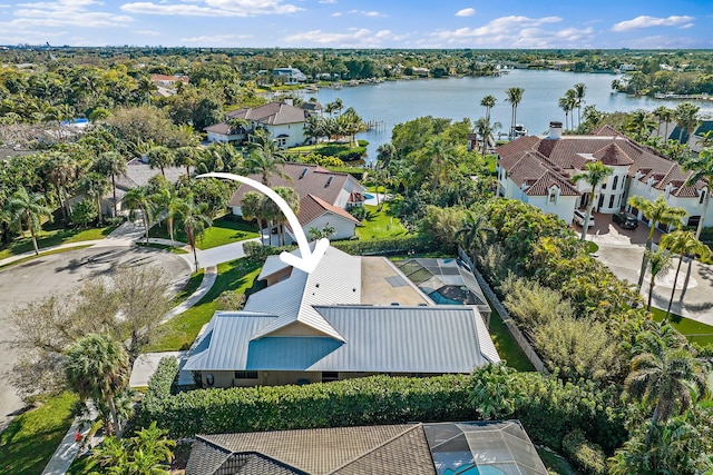 drone / aerial view featuring a water view and a residential view