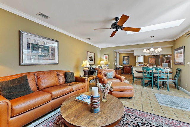 living room featuring ornamental molding, ceiling fan with notable chandelier, visible vents, and light tile patterned floors