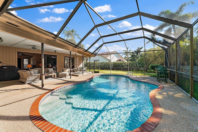 view of swimming pool featuring a fenced in pool, a ceiling fan, glass enclosure, an outdoor hangout area, and a patio area