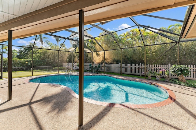 view of swimming pool with a fenced backyard, a patio area, a lanai, and a fenced in pool