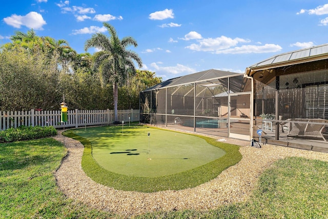 view of yard with a patio, a fenced backyard, a fenced in pool, and a lanai