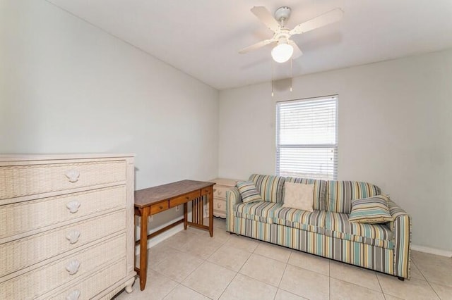 sitting room featuring ceiling fan and light tile patterned floors