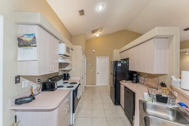 kitchen featuring white appliances, visible vents, light countertops, under cabinet range hood, and a sink