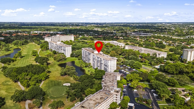 drone / aerial view featuring a water view and a city view