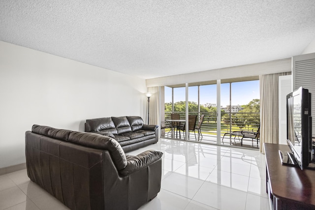 living room with light tile patterned floors and a textured ceiling