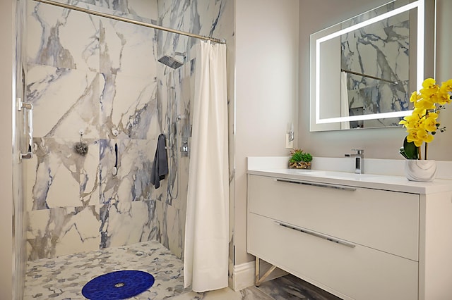 full bath featuring a shower stall and vanity