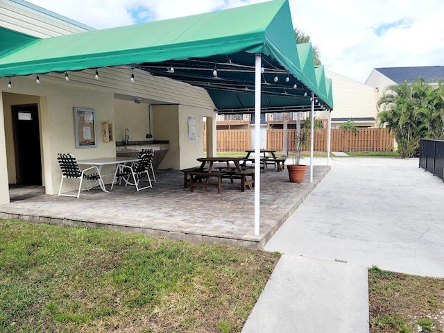 view of patio / terrace featuring fence