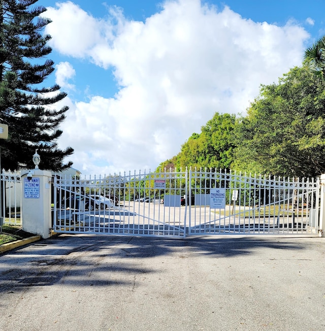 view of gate featuring fence