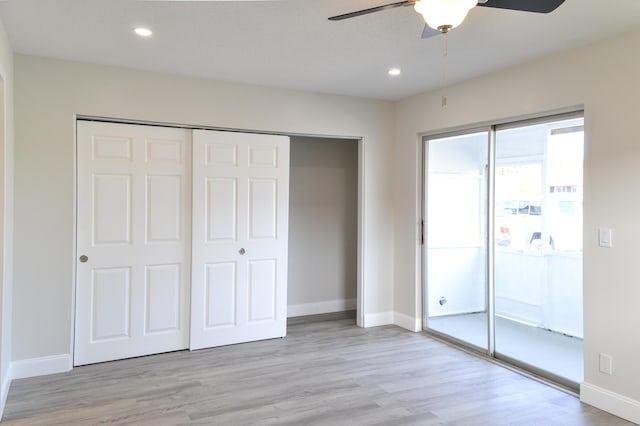 unfurnished bedroom featuring baseboards and light wood-style floors