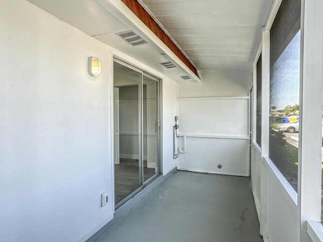 unfurnished sunroom with visible vents