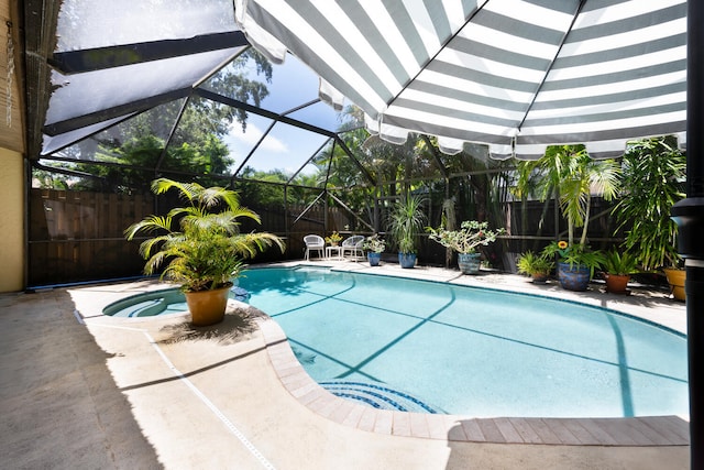 view of pool featuring a patio area, a fenced backyard, a fenced in pool, and a lanai