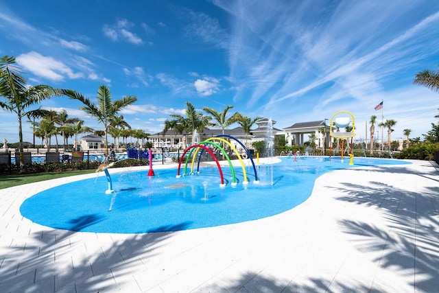 view of pool with playground community