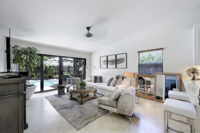 living room featuring a ceiling fan, french doors, and plenty of natural light