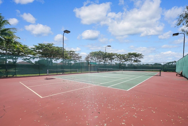 view of sport court featuring community basketball court and fence