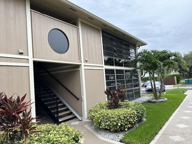 view of property exterior featuring stairway