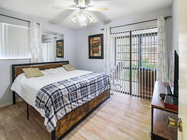 bedroom with access to outside, ceiling fan, baseboards, and wood finished floors