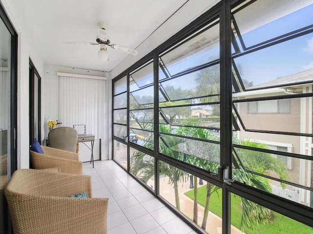 sunroom / solarium featuring a ceiling fan and a wealth of natural light