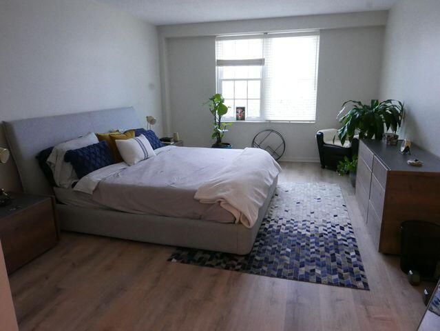 bedroom with light wood finished floors