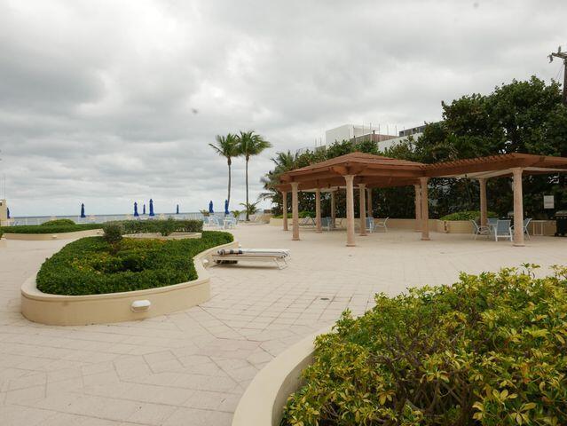 surrounding community featuring a patio area and a pergola