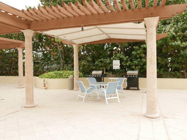 view of patio / terrace with outdoor dining space, grilling area, and a pergola