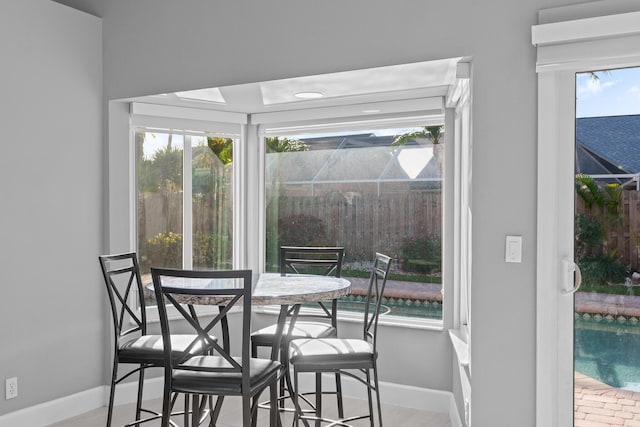 dining space featuring baseboards