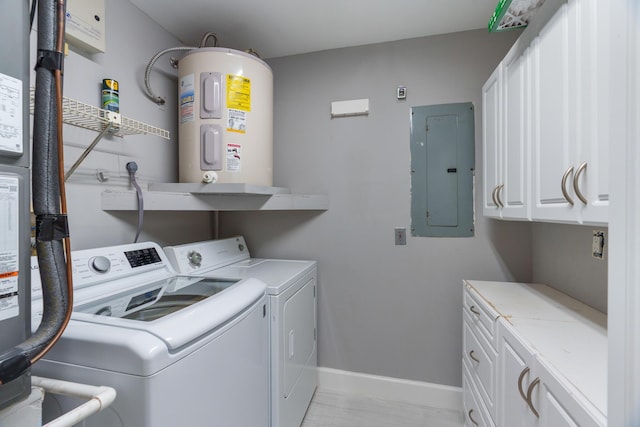 clothes washing area with cabinet space, electric panel, baseboards, washer and clothes dryer, and water heater