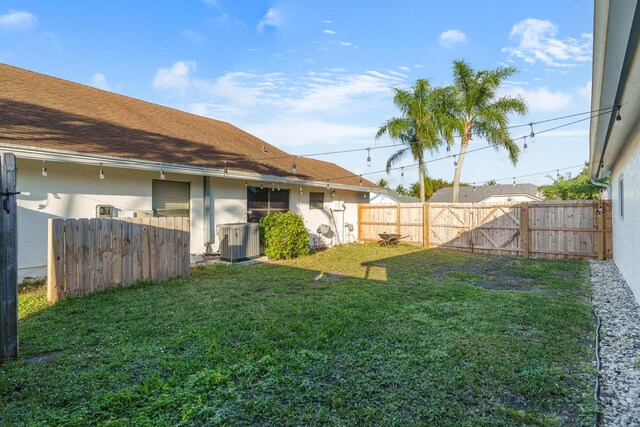 view of swimming pool with a fenced in pool, glass enclosure, a patio, and a fenced backyard