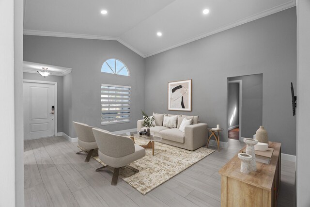 entrance foyer with light wood-type flooring, baseboards, visible vents, and crown molding