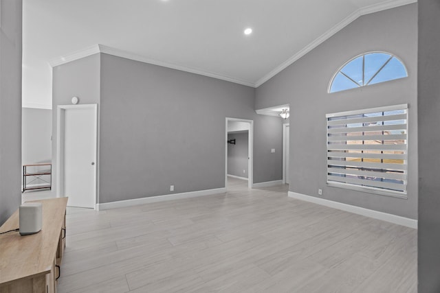 living area with ornamental molding, light wood-type flooring, and baseboards