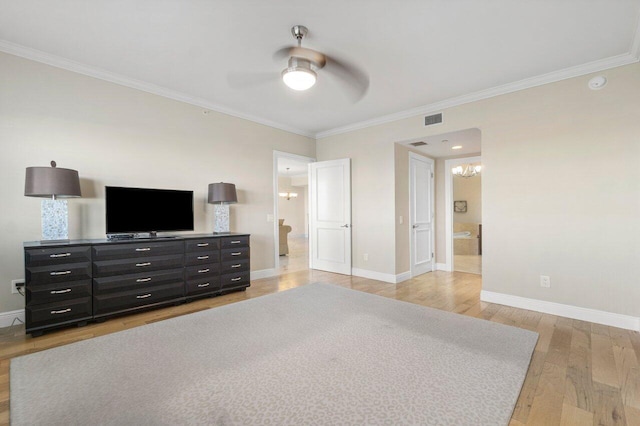 bedroom with light wood finished floors, baseboards, visible vents, ensuite bath, and crown molding