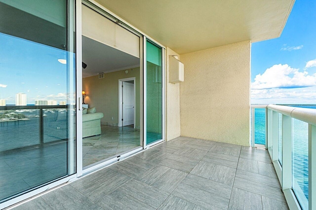 balcony featuring visible vents and a city view