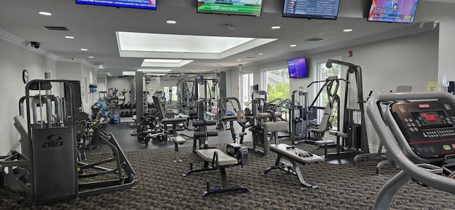 exercise room featuring ornamental molding, recessed lighting, and visible vents