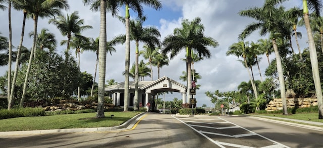 view of road with traffic signs and curbs